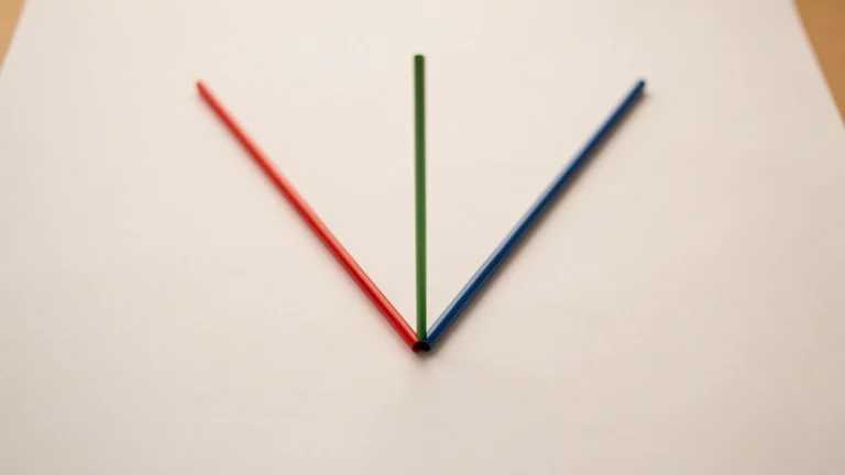 A red rod and a blue rod joined at one point, with a green rod rising from the joint