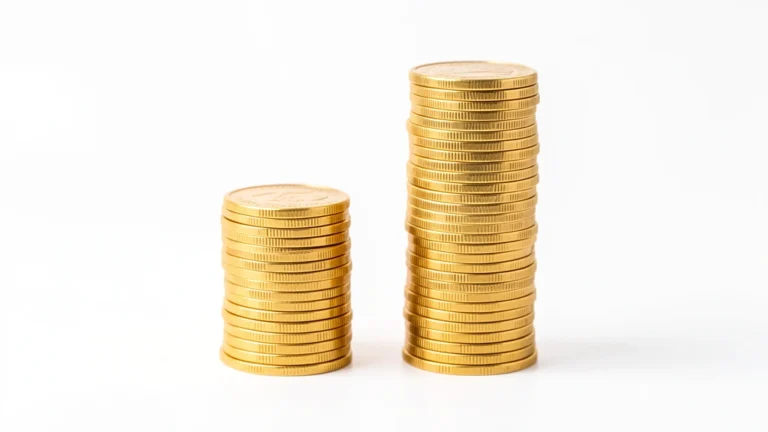 Two stacks of gold coins side by side, the second stack twice as tall as the first, representing money doubling, no text in image