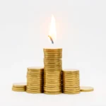 A spark or flame rising over a growing stack of coins, symbolizing the financial independence concept behind the FIRE movement, no text in image