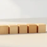 Row of wooden blocks beside a brass hourglass, representing the seven days of the week