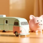 Flat vector scene of a motorhome and a towable trailer parked beside simple coins and an upward road, abstract shapes only